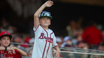 An Atlanta Braves fan in the stands against the Washington Nationals in the third inning at Truist Park.