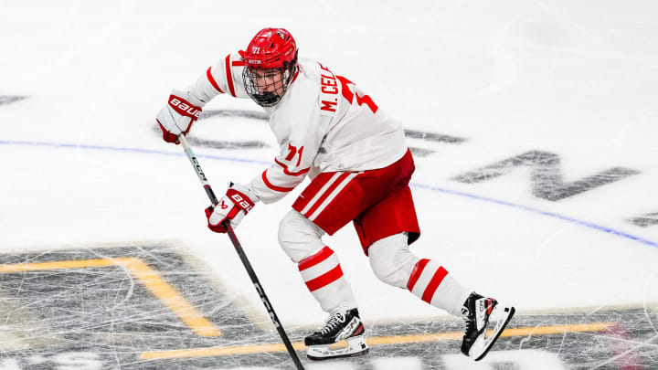 Apr 11, 2024; Saint Paul, Minnesota, USA; Boston U forward Macklin Celebrini (71) carries the puck in the semifinals of the 2024 Frozen Four college ice hockey tournament during the second period against Denver at Xcel Energy Center. Mandatory Credit: Brace Hemmelgarn-USA TODAY Sports