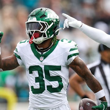 Dec 15, 2024; Jacksonville, Florida, USA; New York Jets safety Jalen Mills (35) celebrates after an interception against the Jacksonville Jaguars in the first quarter at EverBank Stadium. Mandatory Credit: Nathan Ray Seebeck-Imagn Images