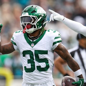 Dec 15, 2024; Jacksonville, Florida, USA; New York Jets safety Jalen Mills (35) celebrates after an interception against the Jacksonville Jaguars in the first quarter at EverBank Stadium. Mandatory Credit: Nathan Ray Seebeck-Imagn Images