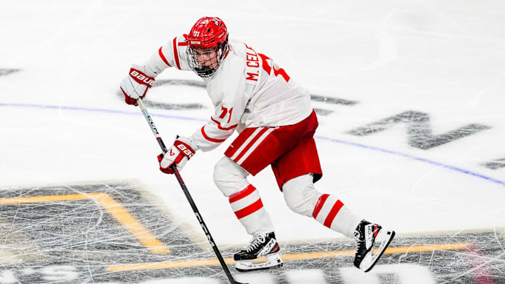 Apr 11, 2024; Saint Paul, Minnesota, USA; Boston U forward Macklin Celebrini (71) carries the puck in the semifinals of the 2024 Frozen Four college ice hockey tournament during the second period against Denver at Xcel Energy Center. Mandatory Credit: Brace Hemmelgarn-Imagn Images