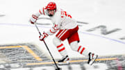Apr 11, 2024; Saint Paul, Minnesota, USA; Boston U forward Macklin Celebrini (71) carries the puck in the semifinals of the 2024 Frozen Four college ice hockey tournament during the second period against Denver at Xcel Energy Center. Mandatory Credit: Brace Hemmelgarn-Imagn Images