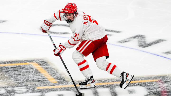 Apr 11, 2024; Saint Paul, Minnesota, USA; Boston U forward Macklin Celebrini (71) carries the puck in the semifinals of the 2024 Frozen Four college ice hockey tournament during the second period against Denver at Xcel Energy Center. Mandatory Credit: Brace Hemmelgarn-Imagn Images