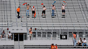 Oklahoma State fans cheer with their shirts off during a college football game between the Oklahoma State Cowboys (OSU) and the Houston Cougars at Boone Pickens Stadium in Stillwater, Okla., Saturday, Oct. 11, 2025. Houston won 39-17.