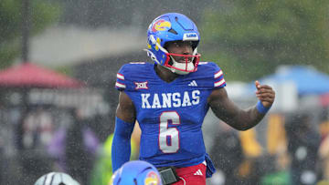 Oct 25, 2025; Lawrence, Kansas, USA; Kansas Jayhawks quarterback Jalon Daniels (6) gestures at the line of scrimmage against the Kansas State Wildcats during the first half of the game at David Booth Kansas Memorial Stadium. Mandatory Credit: Denny Medley-Imagn Images