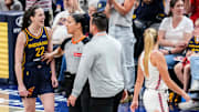Indiana Fever guard Caitlin Clark talks to Connecticut Sun guard Jacy Sheldon during a WNBA regular season game