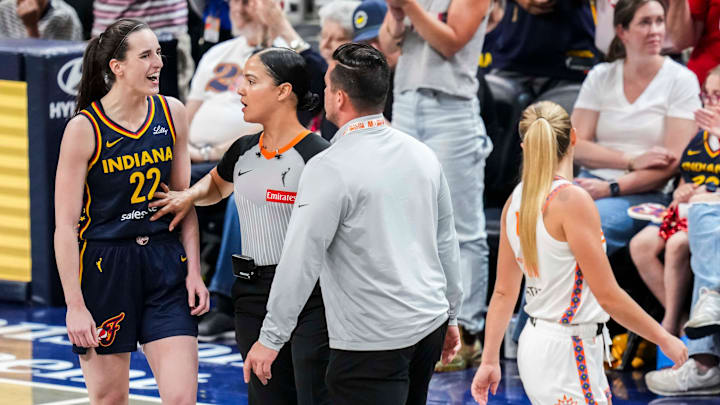 Indiana Fever guard Caitlin Clark talks to Connecticut Sun guard Jacy Sheldon during a WNBA regular season game
