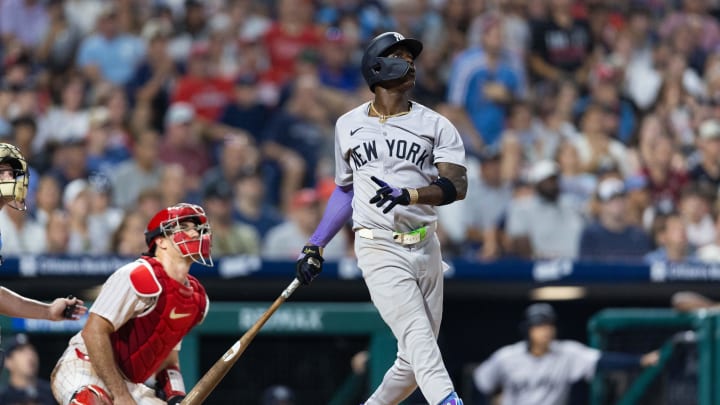 Jul 30, 2024; Philadelphia, Pennsylvania, USA; New York Yankees third base Jazz Chisholm Jr. (13) hits a three RBI home run during the seventh inning against the Philadelphia Phillies at Citizens Bank Park.