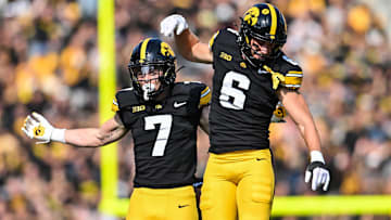 Oct 12, 2024; Iowa City, Iowa, USA; Iowa Hawkeyes defensive back John Nestor (7) and defensive back Zach Lutmer (6) react during the fourth quarter against the Washington Huskies at Kinnick Stadium. Mandatory Credit: Jeffrey Becker-Imagn Images