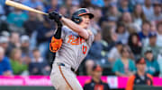 Baltimore Orioles right fielder Heston Kjerstad (13) hits a two-run triple during the seventh inning against the Seattle Mariners at T-Mobile Park. 