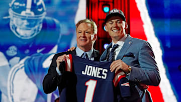 Apr 29, 2021; Cleveland, Ohio, USA; Mac Jones (Alabama) with NFL commissioner Roger Goodell after being selected by the New England Patriots as the number 15 overall pick in the first round of the 2021 NFL Draft at First Energy Stadium. Mandatory Credit: Kirby Lee-Imagn Images