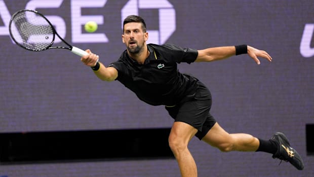 Novak Djokovic hits the ball