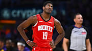Apr 11, 2025; Los Angeles, California, USA; Houston Rockets guard Nate Williams (19) reacts to the video replay against the Los Angeles Lakers during the second half at Crypto.com Arena. Mandatory Credit: Jonathan Hui-Imagn Images