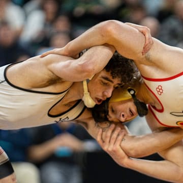 Saint John Vianney’s Anthony Knox, left, wrestles Bergen Catholic’s Nathan Braun in the championship XX match during finals of the NJSIAA individual wrestling state championships at Boardwalk Hall in Atlantic City on Friday, March 8, 2025. Saint John Vianney’s Anthony Knox is awarded the 126lb state championship title and is a 4-time state champion.