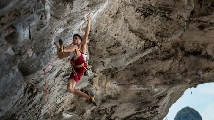 Climber on an overhanging cliff