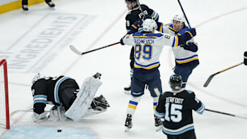 Feb 2, 2025; Salt Lake City, Utah, USA; St. Louis Blues center Jordan Kyrou (25) and left wing Pavel Buchnevich (89) celebrate a Blues goal against the Utah Hockey Club during the third period at Delta Center. Mandatory Credit: Chris Nicoll-Imagn Images