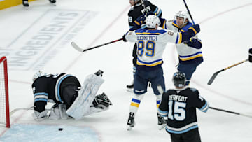 Feb 2, 2025; Salt Lake City, Utah, USA; St. Louis Blues center Jordan Kyrou (25) and left wing Pavel Buchnevich (89) celebrate a Blues goal against the Utah Hockey Club during the third period at Delta Center. Mandatory Credit: Chris Nicoll-Imagn Images