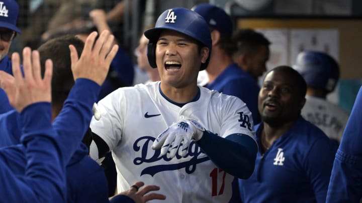 Shohei Ohtani celebrates in the Dodgers dugout