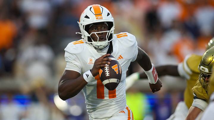 Sep 12, 2026; Atlanta, Georgia, USA; Tennessee Volunteers quarterback Faizon Brandon (11) avoids a defender against the Georgia Tech Yellow Jackets in the first quarter at Bobby Dodd Stadium at Hyundai Field. Mandatory Credit: Brett Davis-Imagn Images