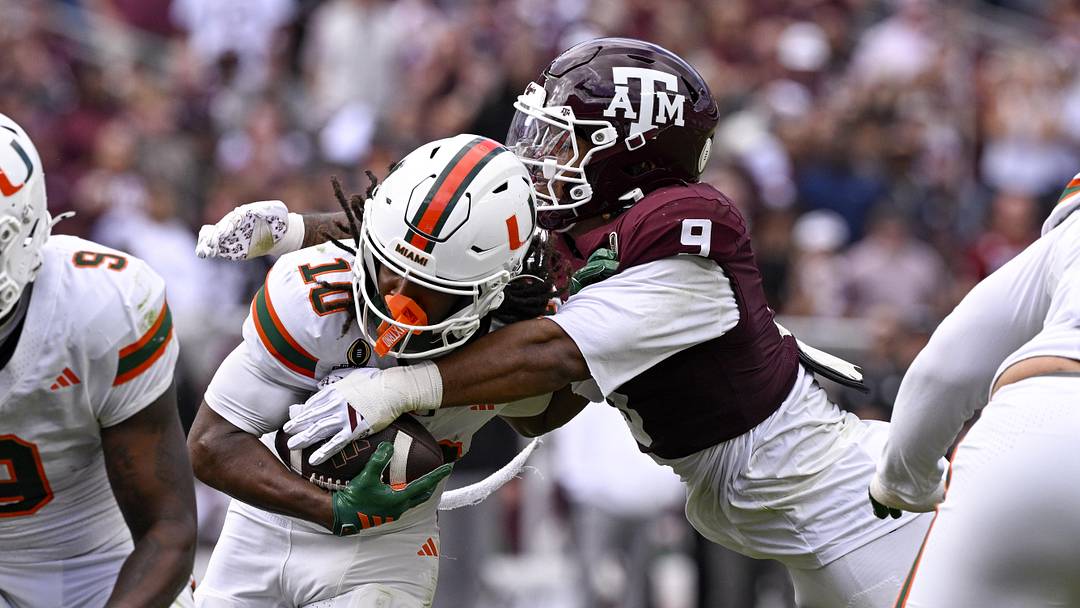 Dec 20, 2025; College Station, TX, USA; Texas A&M Aggies defensive end Cashius Howell (9) tackles Miami Hurricanes wide receiver Malachi Toney (10) during the game between the Aggies and the Hurricanes at Kyle Field. Mandatory Credit: Jerome Miron-Imagn Images