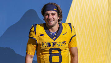 Aug 30, 2025; Morgantown, West Virginia, USA; West Virginia Mountaineers quarterback Nicco Marchiol (8) celebrates with fans after defeating the Robert Morris Colonials at Milan Puskar Stadium. Mandatory Credit: Ben Queen-Imagn Images