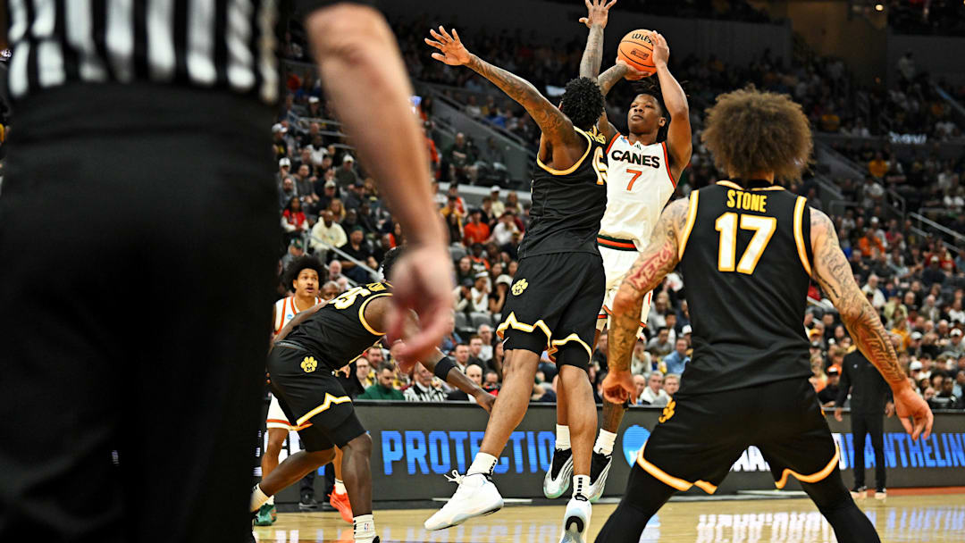 Mar 20, 2026; St. Louis, MO, USA; Miami (FL) Hurricanes forward Shelton Henderson (7) takes a shot at the basket against Missouri Tigers forward Jevon Porter (14) during the first half during a first round game of the men's 2026 NCAA Tournament at Enterprise Center. Mandatory Credit: Jeff Le-Imagn Images