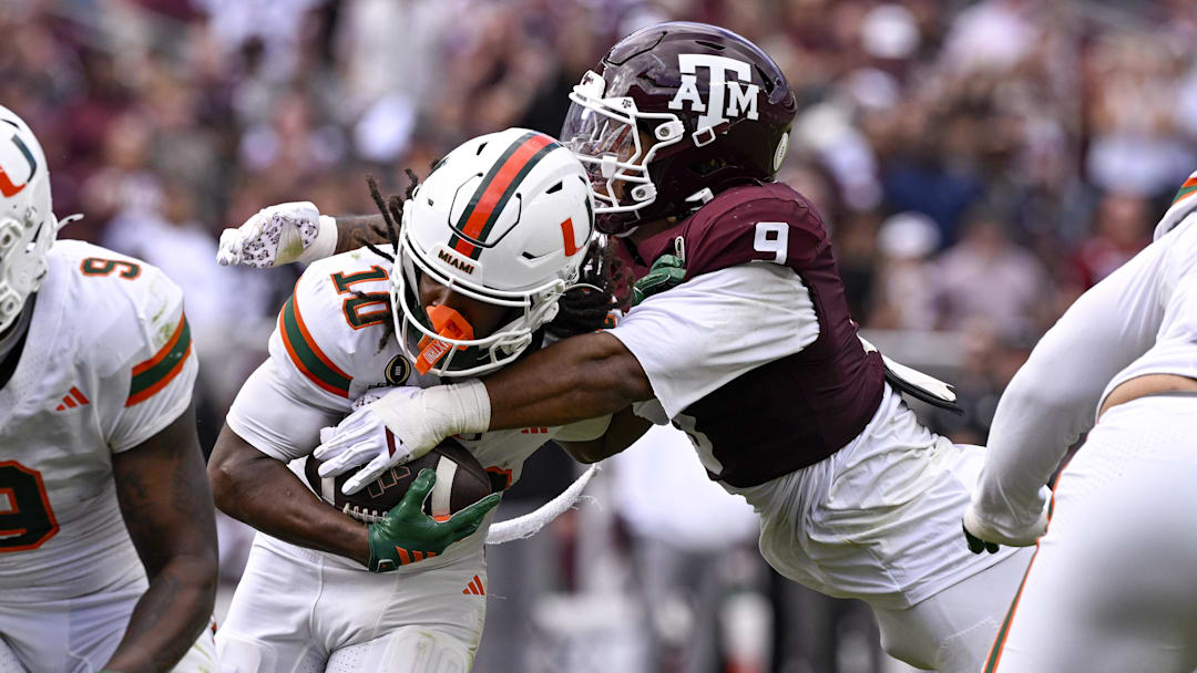 Dec 20, 2025; College Station, TX, USA; Texas A&M Aggies defensive end Cashius Howell (9) tackles Miami Hurricanes wide receiver Malachi Toney (10) during the game between the Aggies and the Hurricanes at Kyle Field.