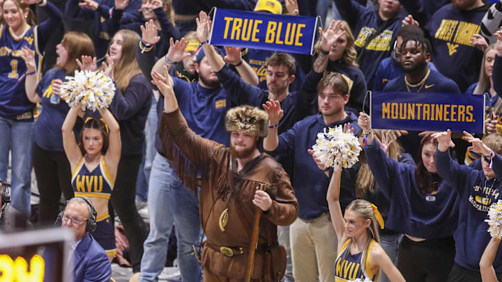 Jan 31, 2026; Morgantown, West Virginia, USA; West Virginia Mountaineers fans pause during a free throw during the second half against the Baylor Bears at Hope Coliseum. Mandatory Credit: Ben Queen-Imagn Images