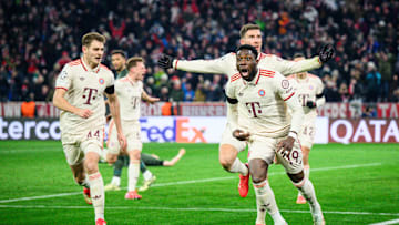 Bayern Munich players celebrating after Alphonso Davies scored late goal against Celtic.