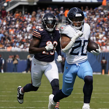 Sep 8, 2024; Chicago, Illinois, USA; Tennessee Titans running back Tony Pollard (20) runs for a touchdown  against the Chicago Bears during the first half at Soldier Field. Mandatory Credit: David Banks-Imagn Images