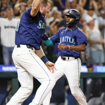 Seattle Mariners pinch runner Ryan Bliss (1) scores the winning run against the Detroit Tigers during the ninth inning at T-Mobile Park on Aug 8.