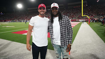Oct 15, 2022; Fresno, California, USA; Las Vegas Raiders quarterback Derek Carr and wide receiver Davante Adams pose for a photo at halftime of the Fresno State Bulldogs vs San Jose State Spartans game at Valley Children's Stadium. Mandatory Credit: Cary Edmondson-Imagn Images