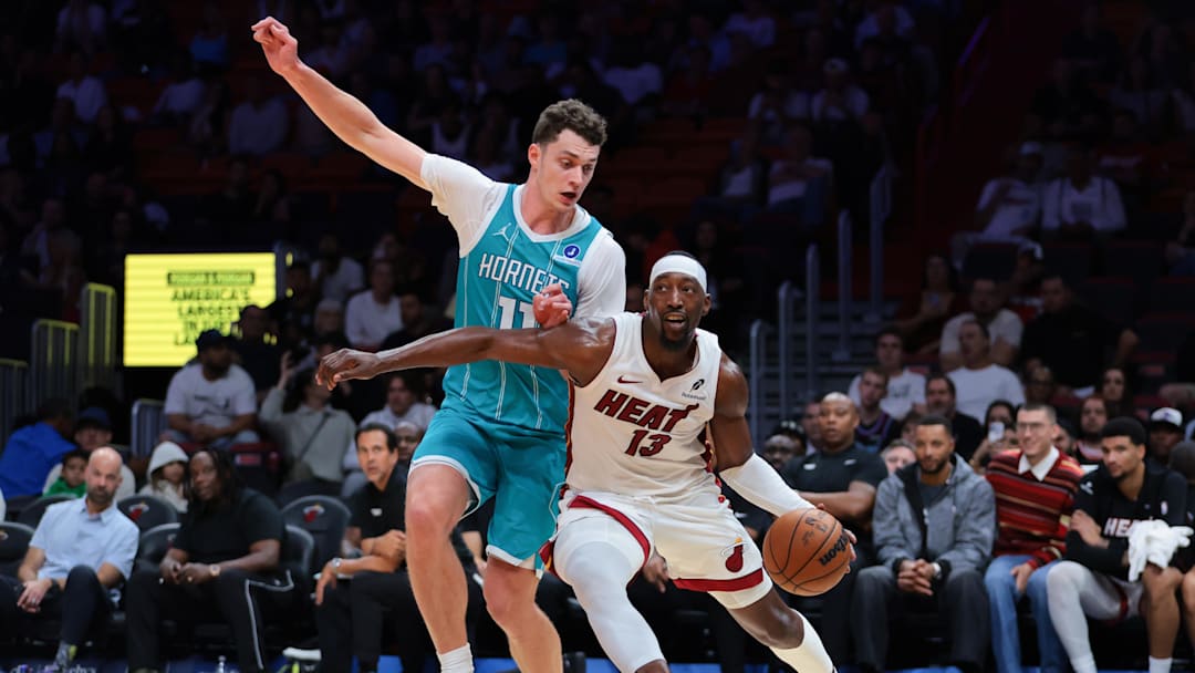 Miami Heat center Bam Adebayo (13) drives to the basket against Charlotte Hornets center Ryan Kalkbrenner