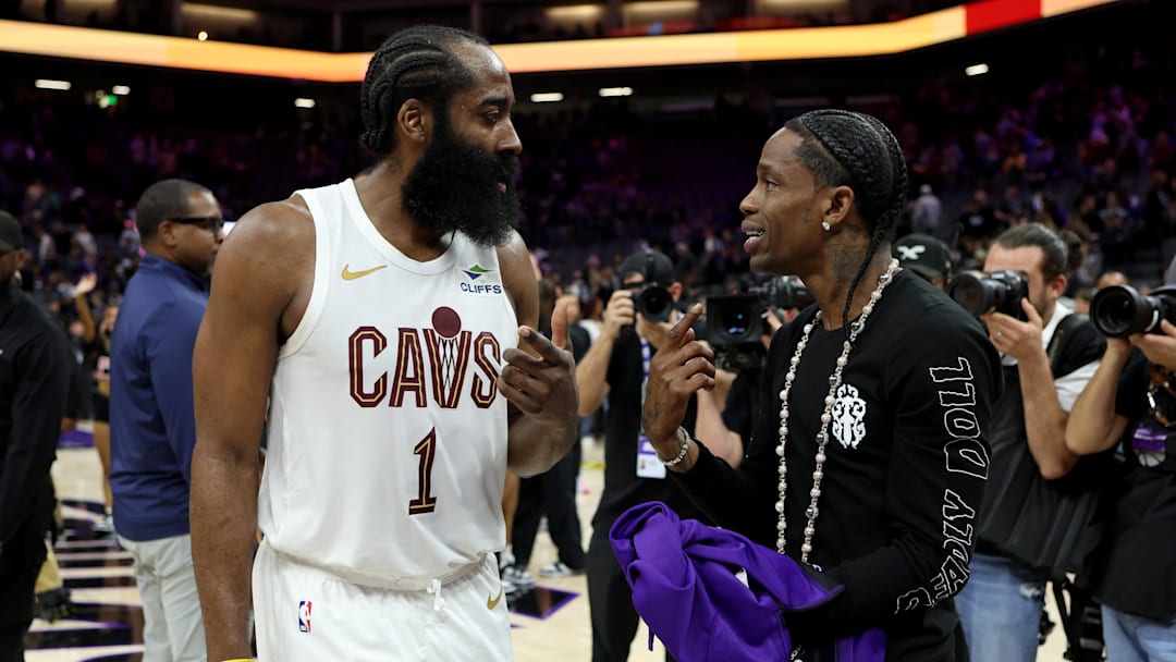 Feb 7, 2026; Sacramento, California, USA; Cleveland Cavaliers guard James Harden (1) talks with rapper Travis Scott after a game against the Sacramento Kings at Golden 1 Center. Mandatory Credit: Dennis Lee-Imagn Images