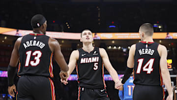 Feb 12, 2025; Oklahoma City, Oklahoma, USA; Miami Heat forward Nikola Jovic (5) celebrates with teammates center Bam Adebayo (13) and guard Tyler Herro (14) after a play against the Oklahoma City Thunder during the second quarter at Paycom Center. Mandatory Credit: Alonzo Adams-Imagn Images