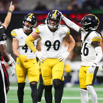 Sep 8, 2024; Atlanta, Georgia, USA; Pittsburgh Steelers linebacker T.J. Watt (90) reacts with cornerback Donte Jackson (26) after a penalty against the Atlanta Falcons in the second quarter at Mercedes-Benz Stadium. Mandatory Credit: Brett Davis-Imagn Images