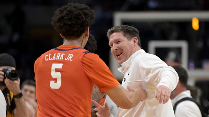 Mar 28, 2024; Los Angeles, CA, USA; Clemson Tigers head coach Brad Brownell celebrates with forward Jack Clark (5) after defeating the Arizona Wildcats in the semifinals of the West Regional of the 2024 NCAA Tournament at Crypto.com Arena. 