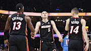 Feb 12, 2025; Oklahoma City, Oklahoma, USA; Miami Heat forward Nikola Jovic (5) celebrates with teammates center Bam Adebayo (13) and guard Tyler Herro (14) after a play against the Oklahoma City Thunder during the second quarter at Paycom Center. Mandatory Credit: Alonzo Adams-Imagn Images