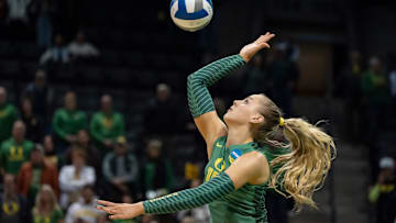 Oregon outside hitter Mimi Colyer serves as the Oregon Ducks host High Point in the first round of the NCAA volleyball tournament on Thursday, Dec. 5, 2024, at Matthew Knight Arena in Eugene, Ore.