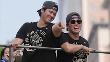 Nov 3, 2025; Los Angeles, CA, USA;  Los Angeles Dodgers two-way player Shohei Ohtani (17) and pitcher Yoshinobu Yamamoto (18) during the World Series championship parade and celebration. Mandatory Credit: Kirby Lee-Imagn Images