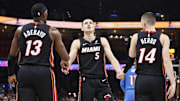 Feb 12, 2025; Oklahoma City, Oklahoma, USA; Miami Heat forward Nikola Jovic (5) celebrates with teammates center Bam Adebayo (13) and guard Tyler Herro (14) after a play against the Oklahoma City Thunder during the second quarter at Paycom Center. Mandatory Credit: Alonzo Adams-Imagn Images