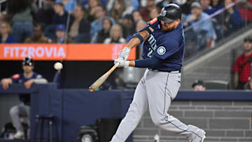Apr 20, 2025; Toronto, Ontario, CAN;  Seattle Mariners first baseman Rowdy Tellez (23) hits a two run home run against the Toronto Blue Jays in the seventh inning at Rogers Centre. 