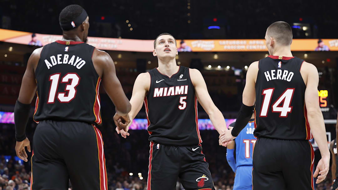 Feb 12, 2025; Oklahoma City, Oklahoma, USA; Miami Heat forward Nikola Jovic (5) celebrates with teammates center Bam Adebayo (13) and guard Tyler Herro (14) after a play against the Oklahoma City Thunder during the second quarter at Paycom Center. Mandatory Credit: Alonzo Adams-Imagn Images