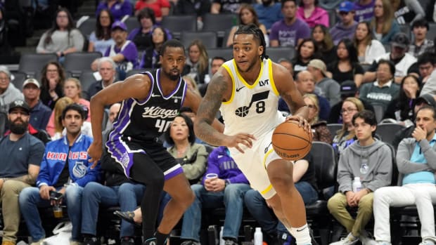 Mar 31, 2024; Sacramento, California, USA; Utah Jazz forward Brice Sensabaugh (8) dribbles against Sacramento Kings forward H