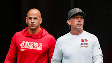 Sep 7, 2025; Seattle, Washington, USA; San Francisco 49ers defensive coordinator Robert Saleh, left, and head coach Kyle Shanahan, right, exit the locker room during pregame warmups against the Seattle Seahawks at Lumen Field. 