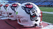 Sep 7, 2024; Charlotte, North Carolina, USA; North Carolina State Wolfpack helmets during pregame activity for the Dukes Mayo Classic against the Tennessee Volunteers at Bank of America Stadium. Mandatory Credit: Jim Dedmon-Imagn Images