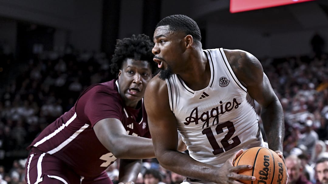 Jan 21, 2026; College Station, Texas, USA; Texas A&M Aggies forward Rashaun Agee (12) looks to pass the ball as Mississippi State Bulldogs forward Brandon Walker (4) defends during the first half at Reed Arena. Mandatory Credit: Maria Lysaker-Imagn Images 