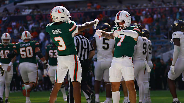 Nov 23, 2024; Miami Gardens, Florida, USA; Miami Hurricanes wide receiver Jacolby George (3) celebrates with Miami Hurricanes wide receiver Xavier Restrepo (7) after scoring a touchdown against the Wake Forest Demon Deacons during the first quarter at Hard Rock Stadium. Mandatory Credit: Sam Navarro-Imagn Images