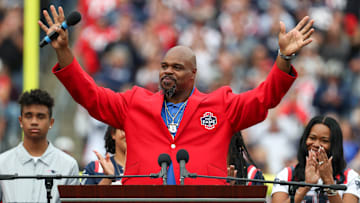 Sep 25, 2022; Foxborough, Massachusetts, USA; New England Patriots Hall of Famer Vince Wilfork reacts during a halftime celebration at Gillette Stadium during a game against the Baltimore Ravens. Mandatory Credit: Paul Rutherford-Imagn Images