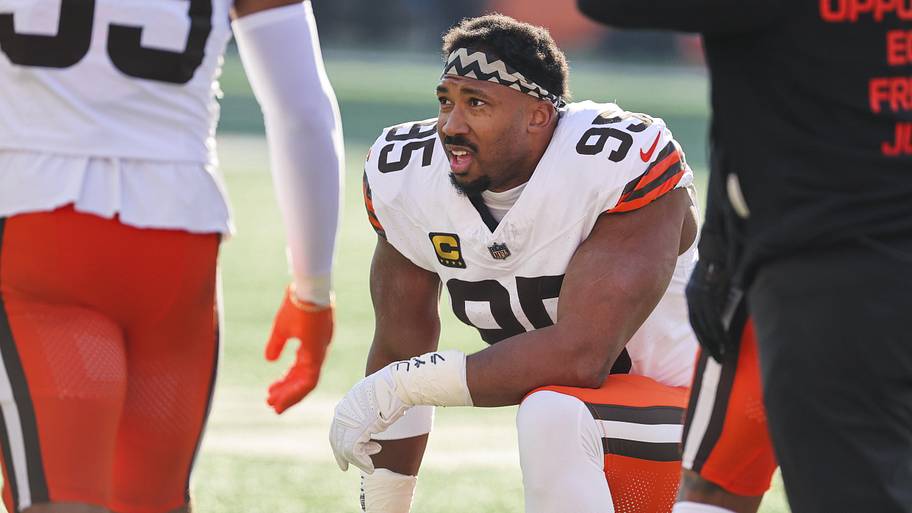 Myles Garrett kneels with his helmet off.